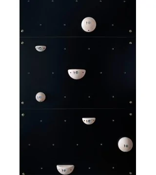 black climbing wall for children with natural wood climbing holds